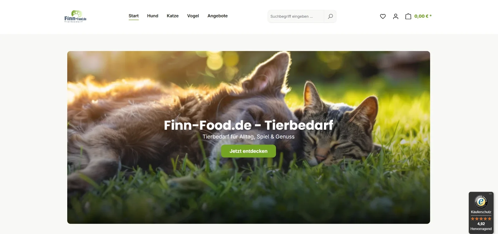 Startseite von Finn-Food.de nach dem Relaunch auf Shopware 6: Hund und Katze im Gras, Claim „Tierbedarf für Alltag, Spiel & Genuss“